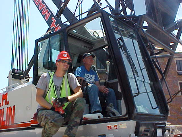 Lewis Troxell running the crane with apprentice Anthony Steinbrunner working for Ben Hur at Ball Memorial Hospital